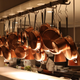 Copper pots hanging in the kitchen at The Bedford